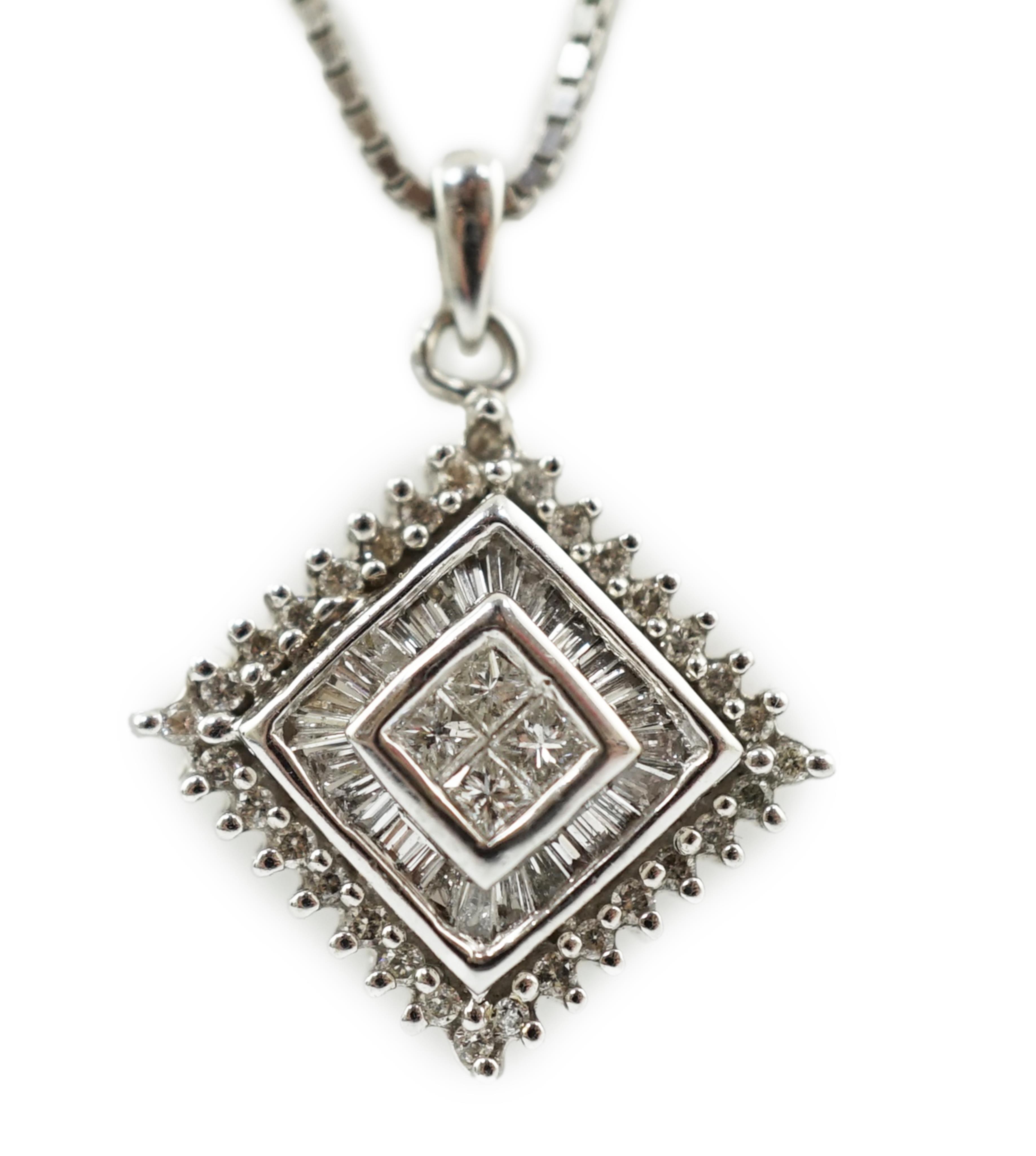 A modern 14k white gold and diamond cluster set pendant, on an Italian 18k white gold fine link chain